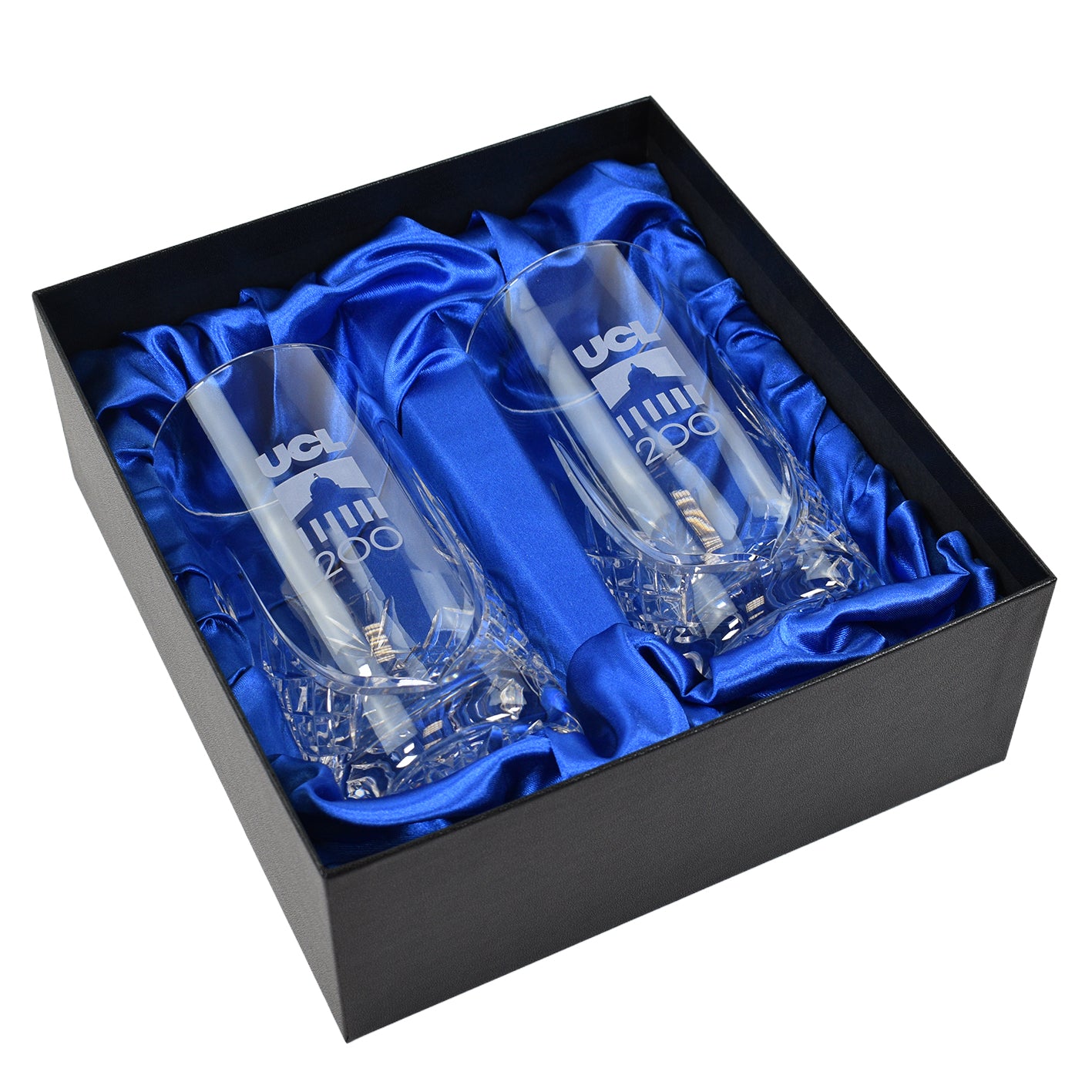 Two clear glasses with engraved text in a black box lined with blue satin